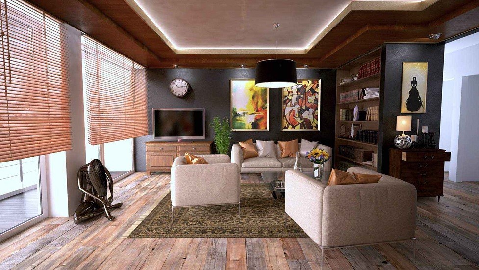 Living room with wood floors, post-modern furniture, and eclectic art highlighted by sunlight through wooden blinds.