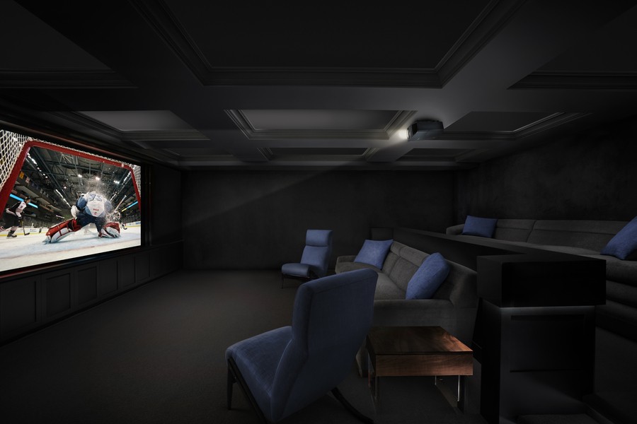 a home theater with a projector and gray seating